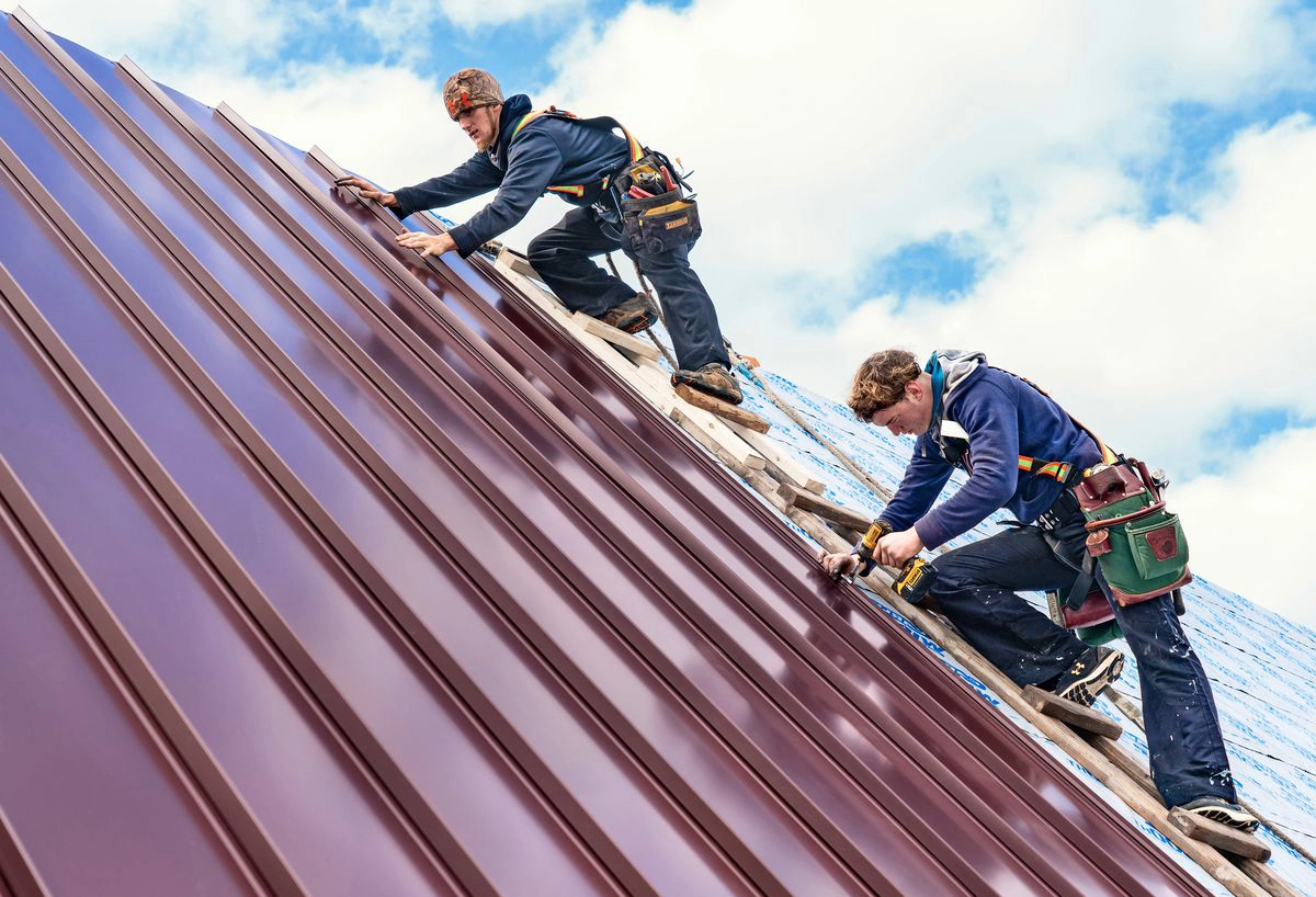 Men working on a aluminum roof